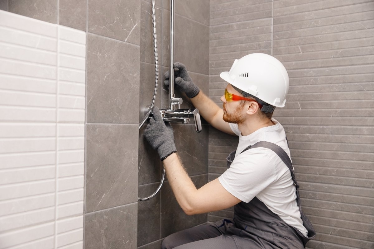 image showing a professional upgrading a bathroom