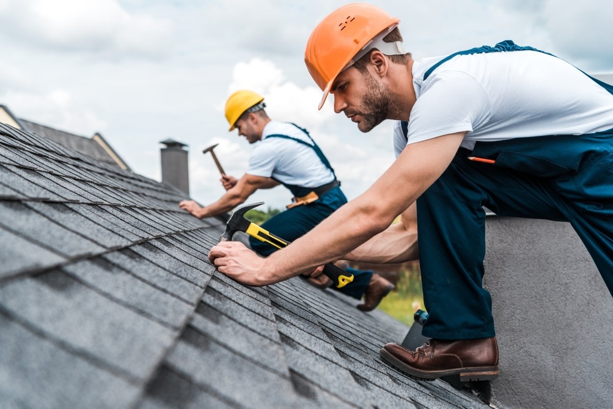 image showing a professional replacing a roof