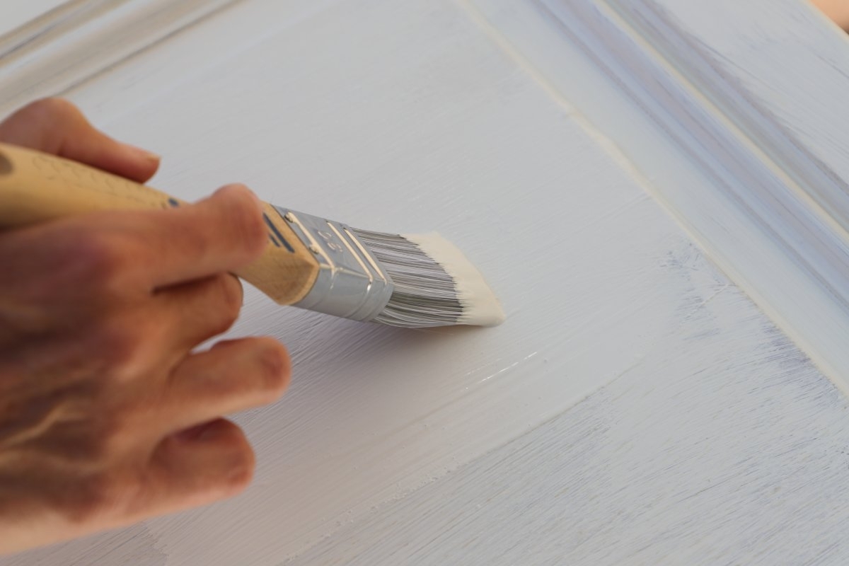 image showing someone repainting cabinets