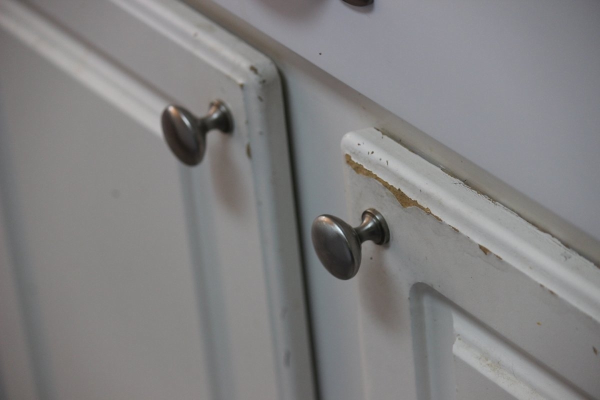 image showing old peeling cabinet needing replacement