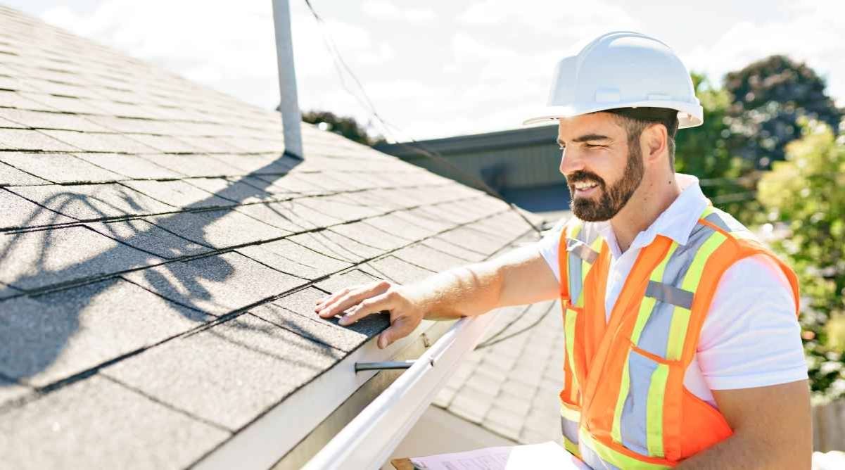 image showing a professional performing roof inspection