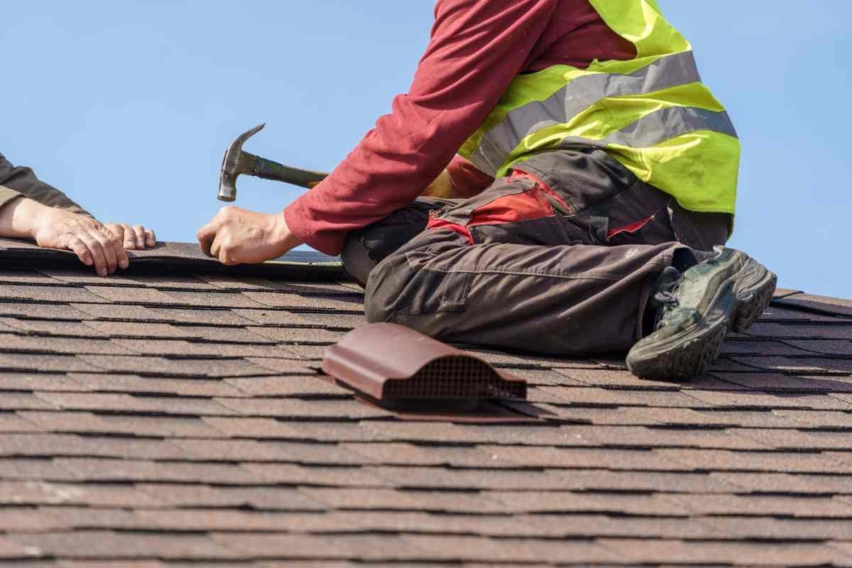 image showing a man performing roof repair