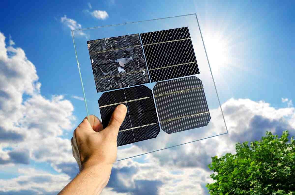 image showing a hand holding samples of different solar panels materials