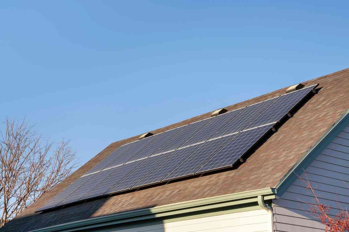 image showing solar panels on a asphalt roof