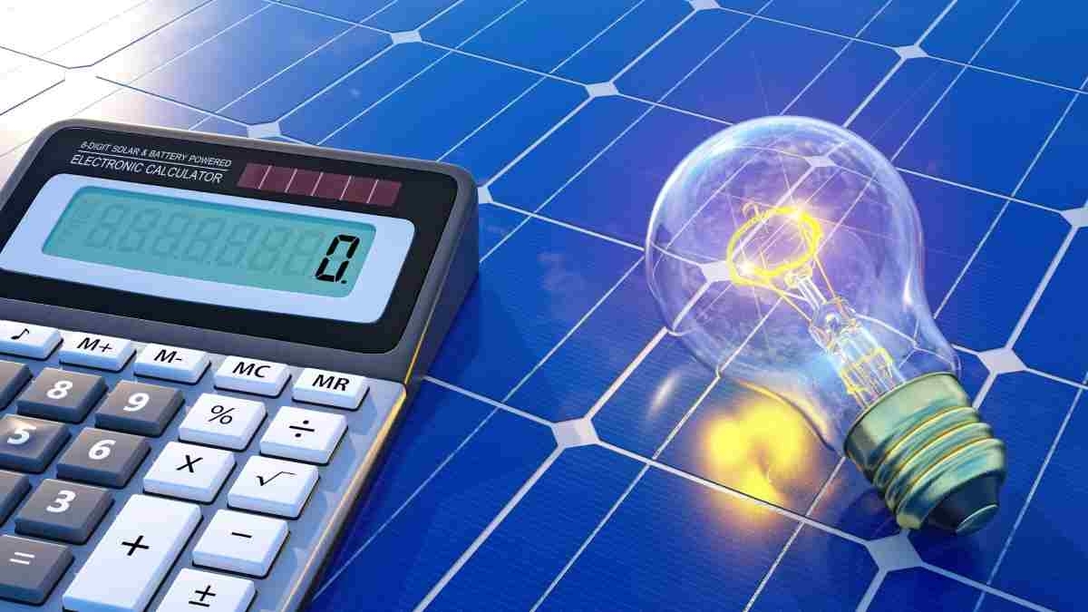image showing a calculator and a light bulb on a solar panel
