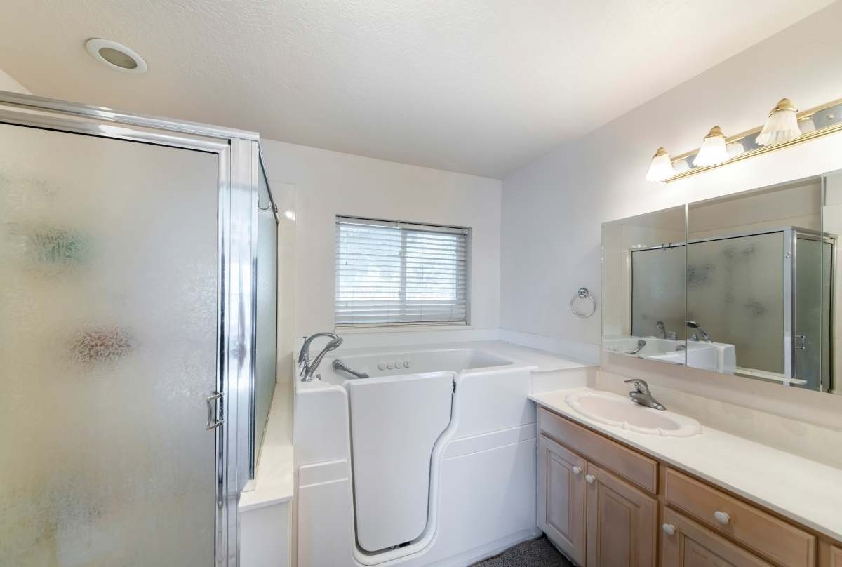 image showing a bathroom with a safe step walk-in tub