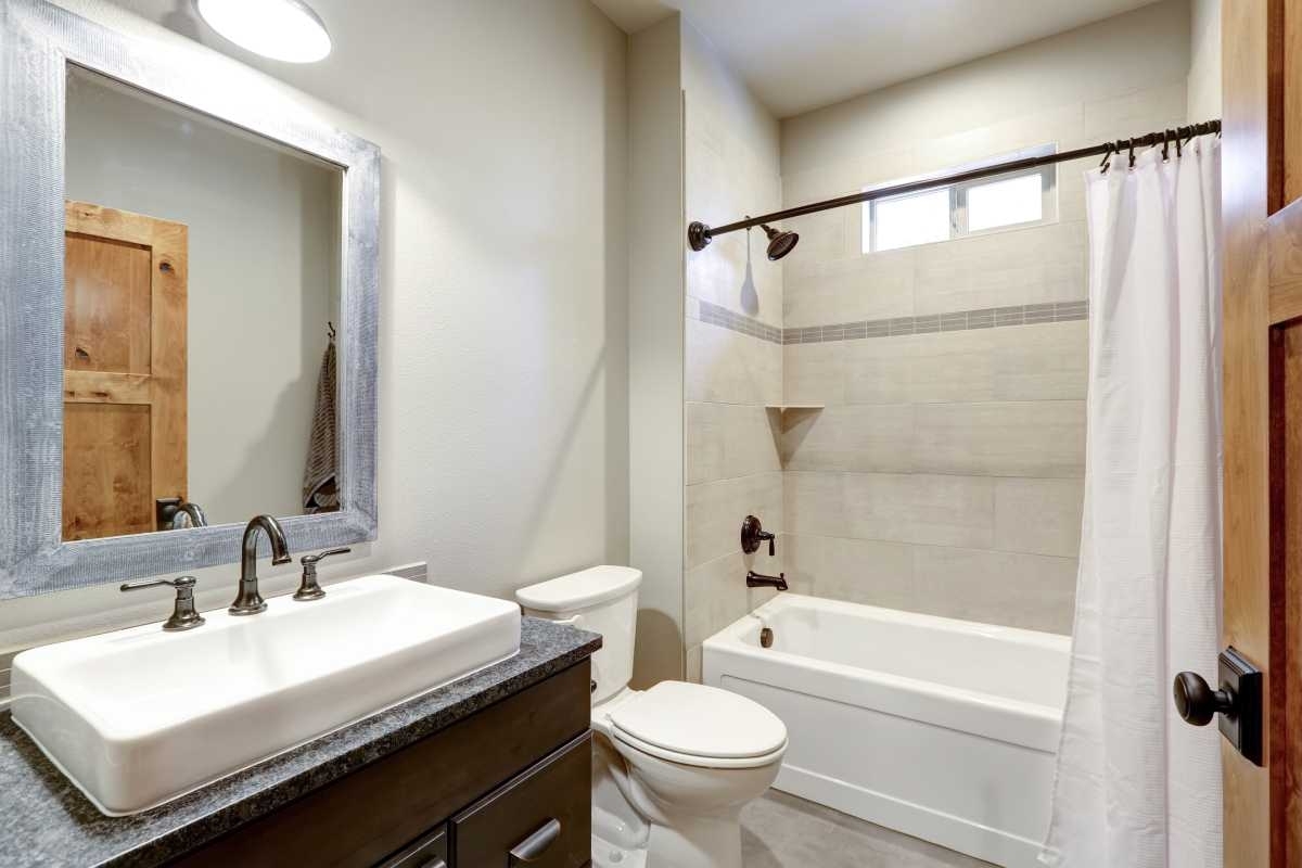 image showing a bathroom with a bath tub and shower combo