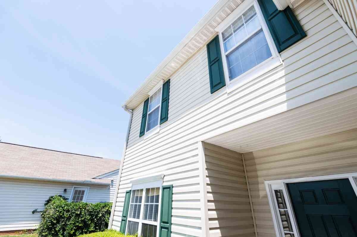 image showing a house with new siding white