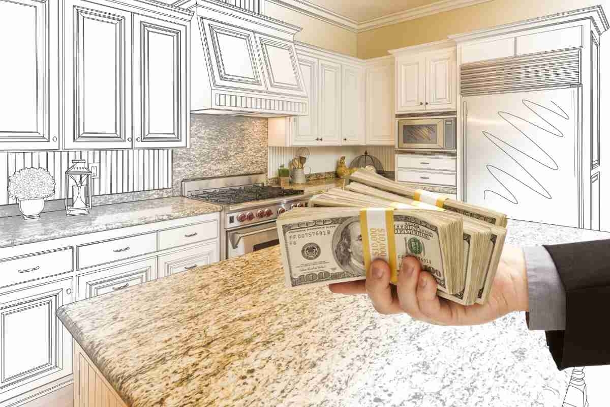 image showing hands offering money for kitchen remodeling while on the background there is a drawing of a kitchen