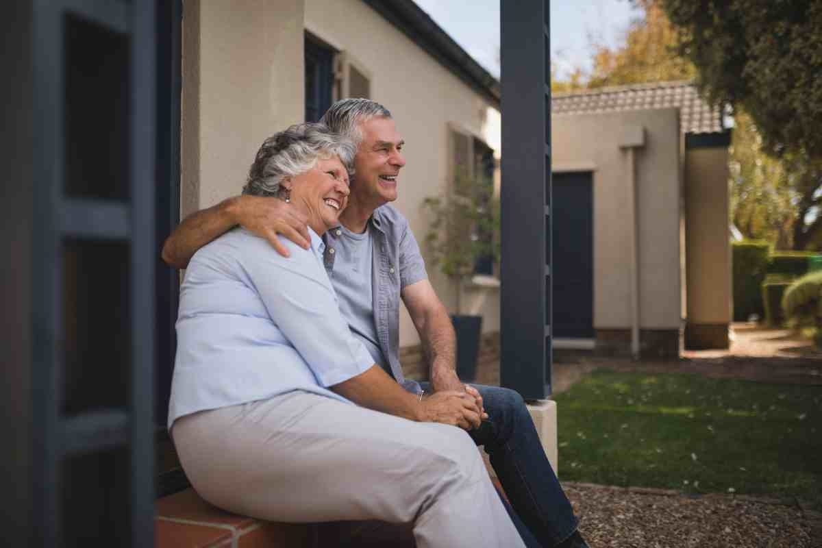 image showing happy senior couple on house patio