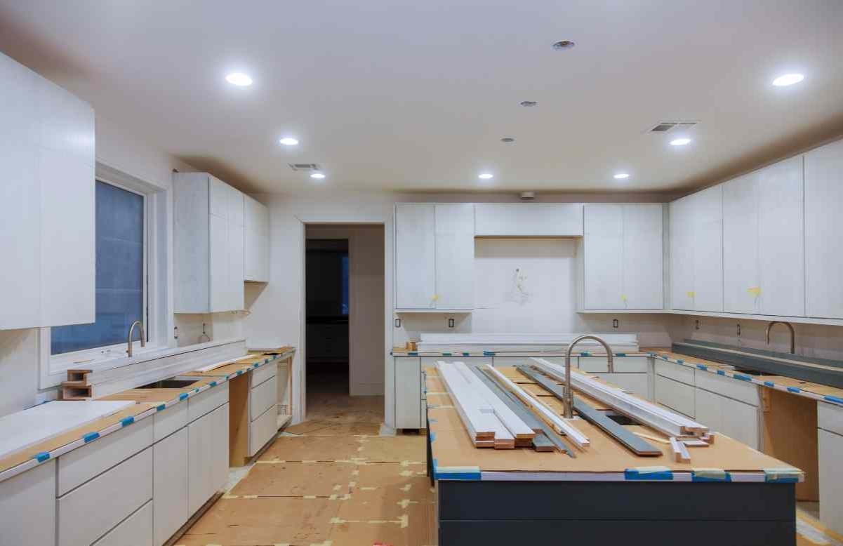 image of kitchen with open shelves and no cabinet doors during a remodeling
