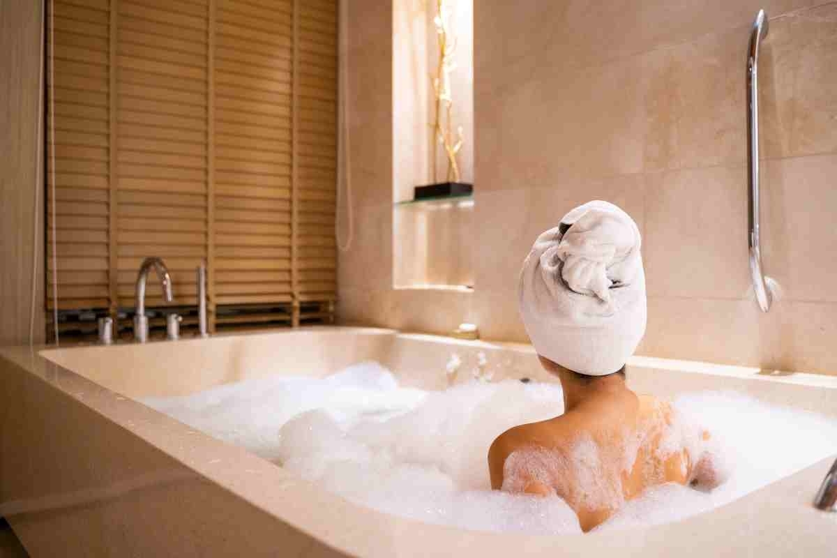 image showing woman relaxing in bathtub