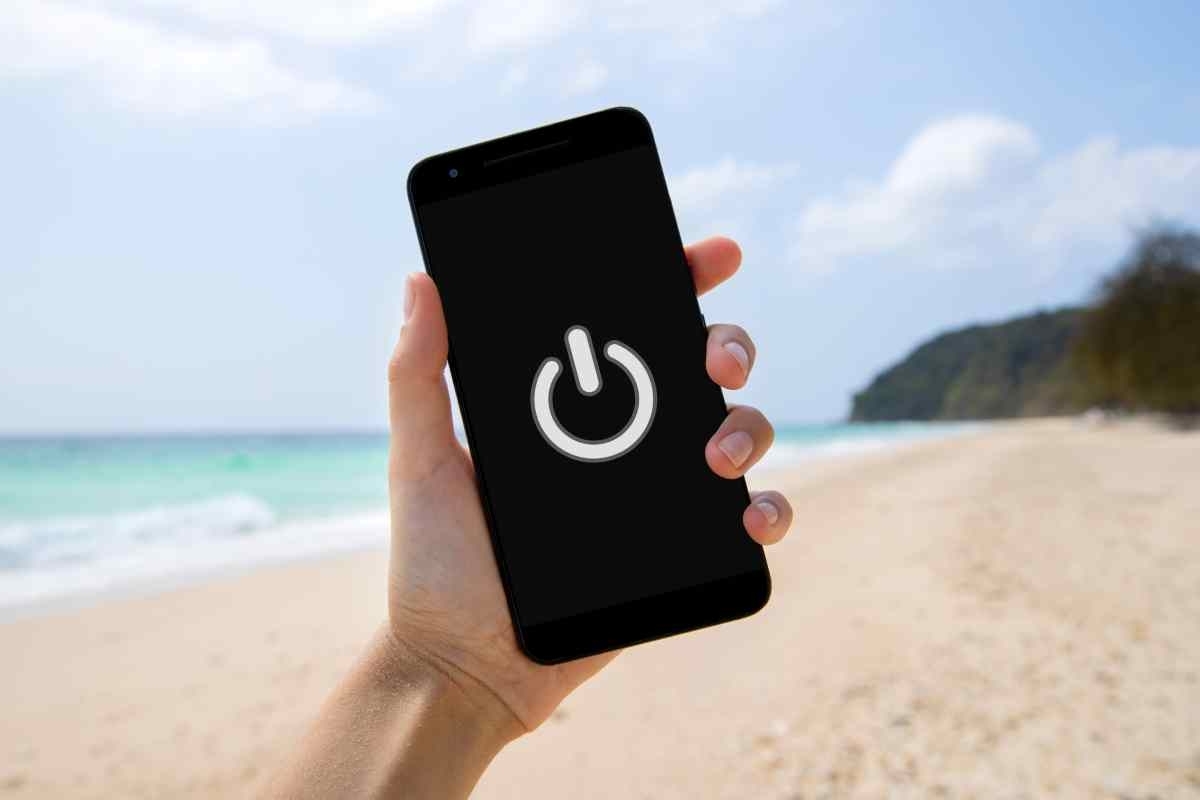 image showing a turned off phone with a beach on the background