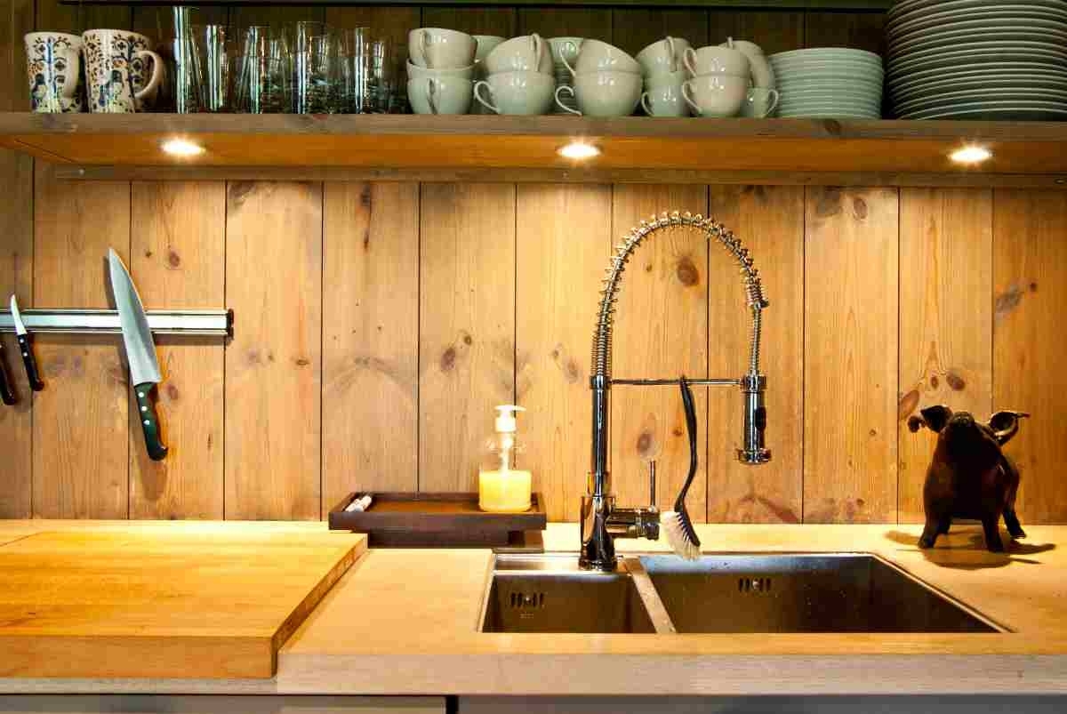 image showing a handy kitchen shelf with mugs and plates in sight