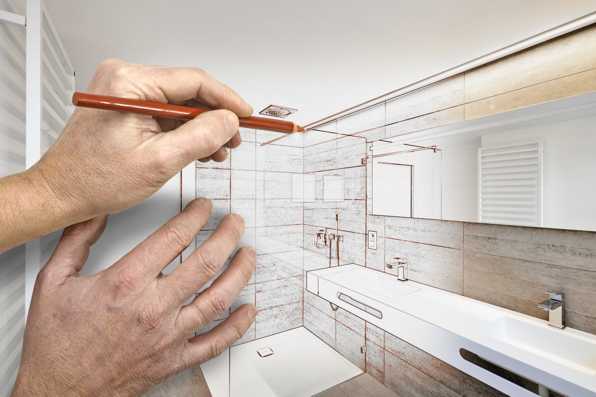 image showing hands drawing a bathroom design