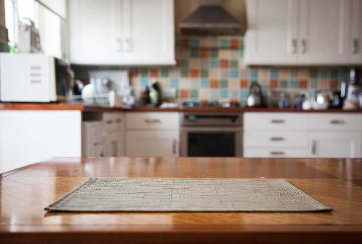 image showing kitchen from perspective of table