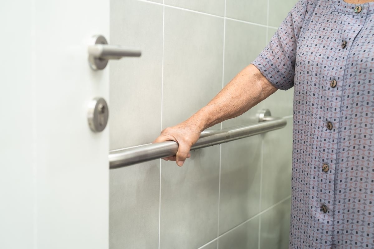image showing hand holding grab bar