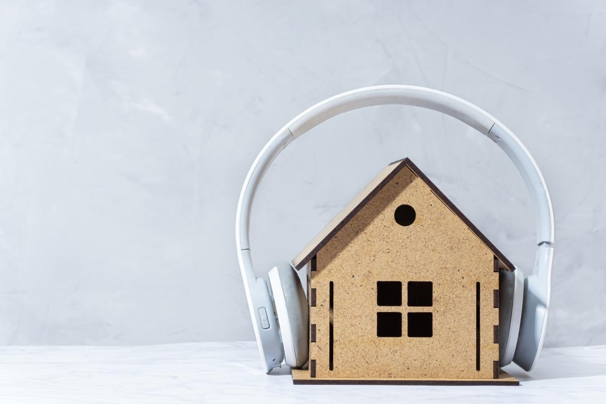 image showing a small house with big headphones