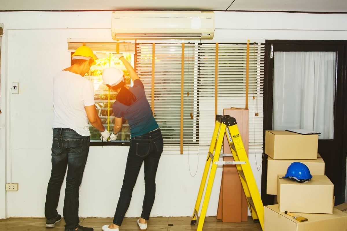 image showing a group of window installers working on a window