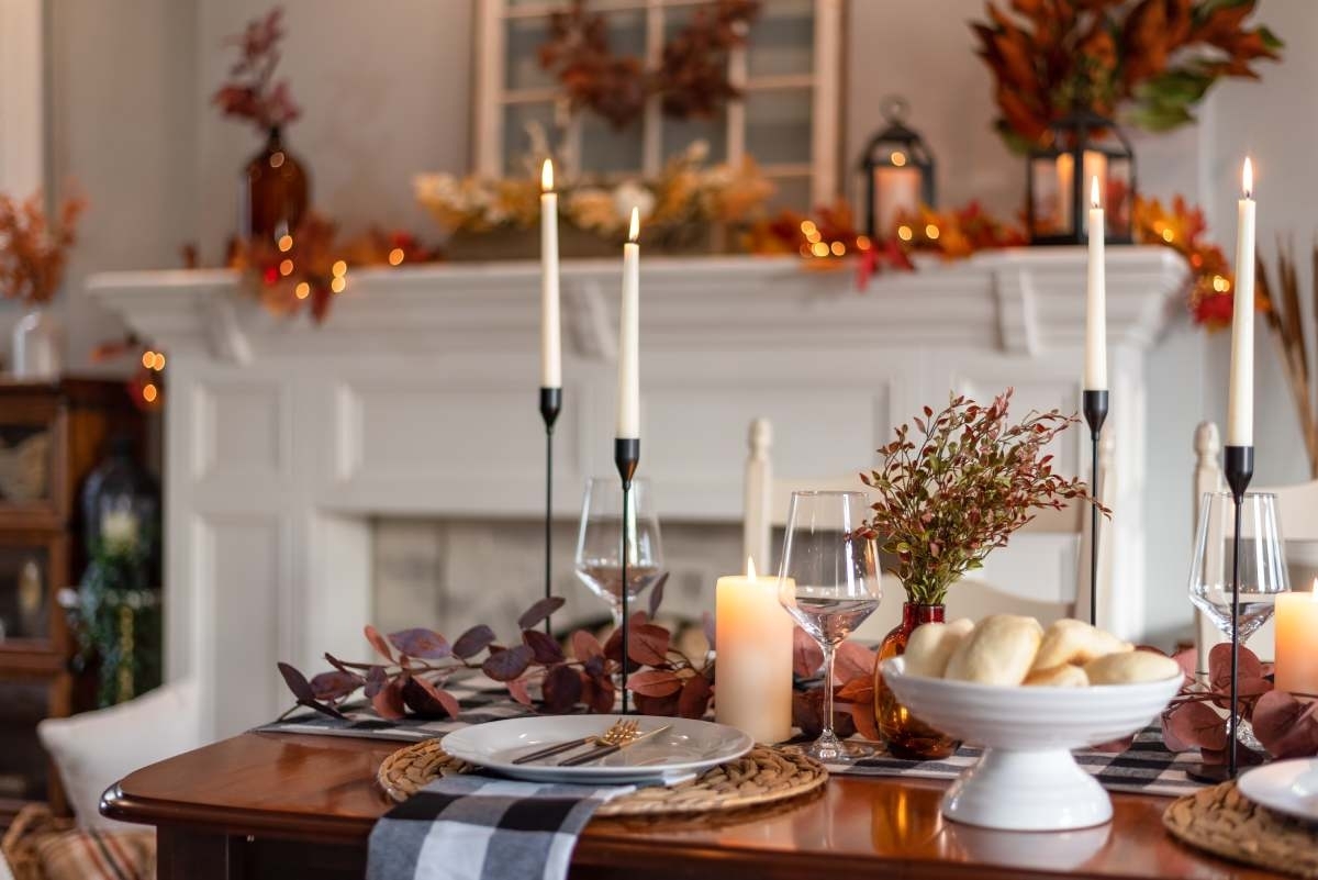 image showing a table with candles and thanksgiving decorations