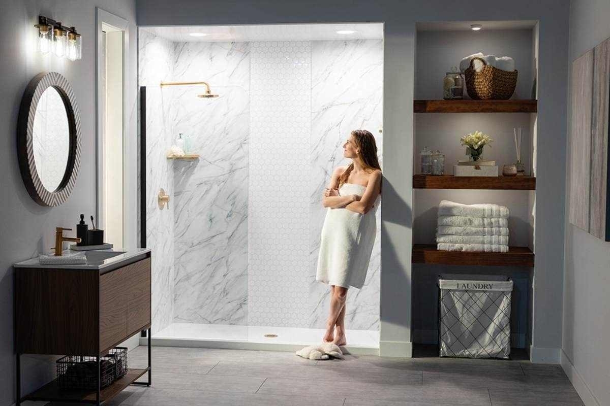image showing a woman in her luxurious bathroom in front of a modern shower
