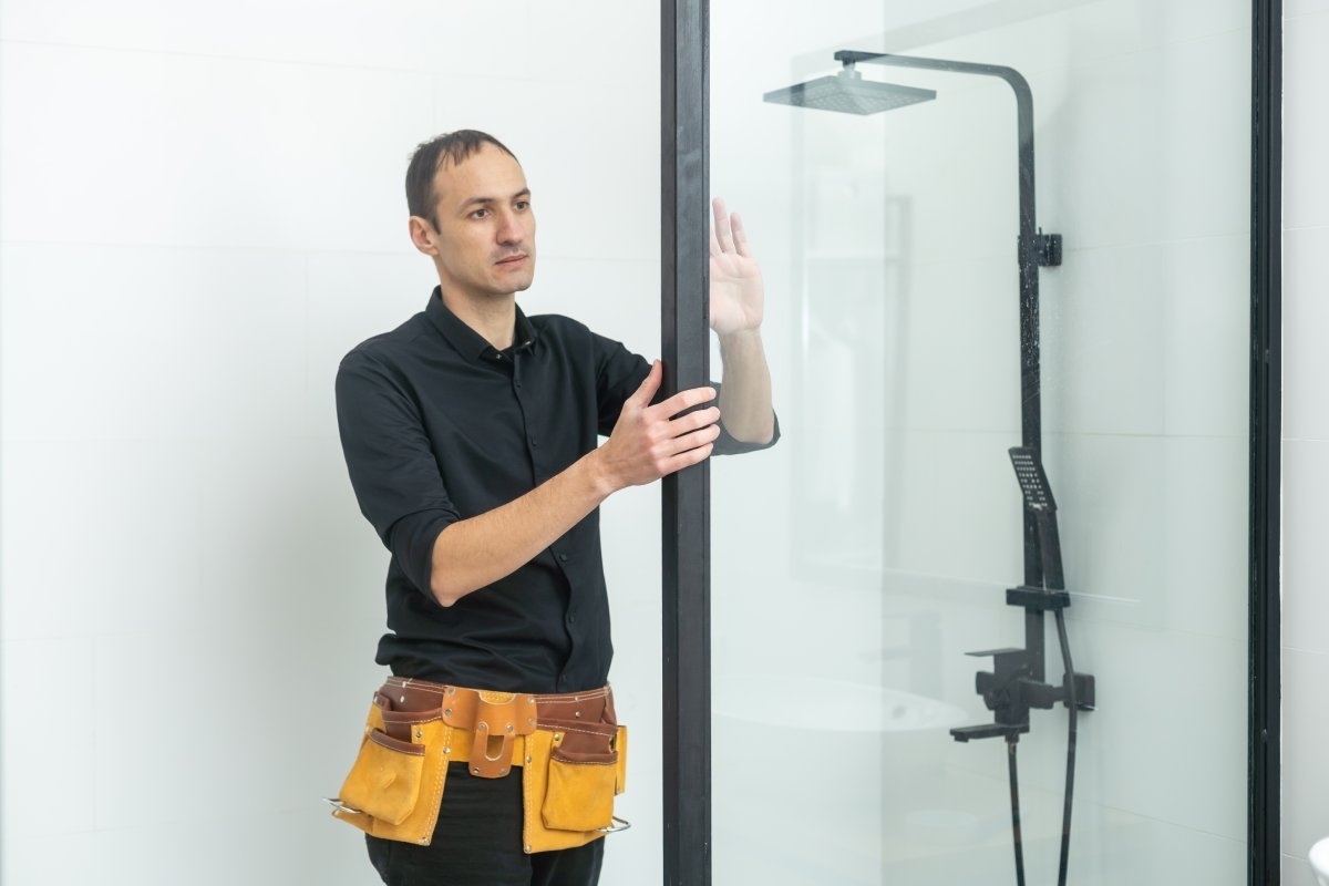 image showing a bath installer in a shower