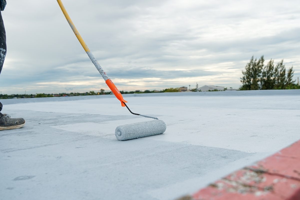 professional finishing a roof replacement