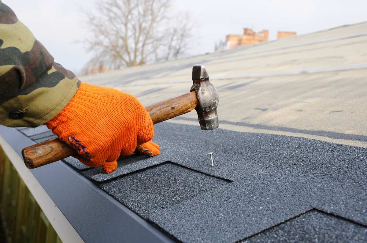 hammer hitting roof during repair