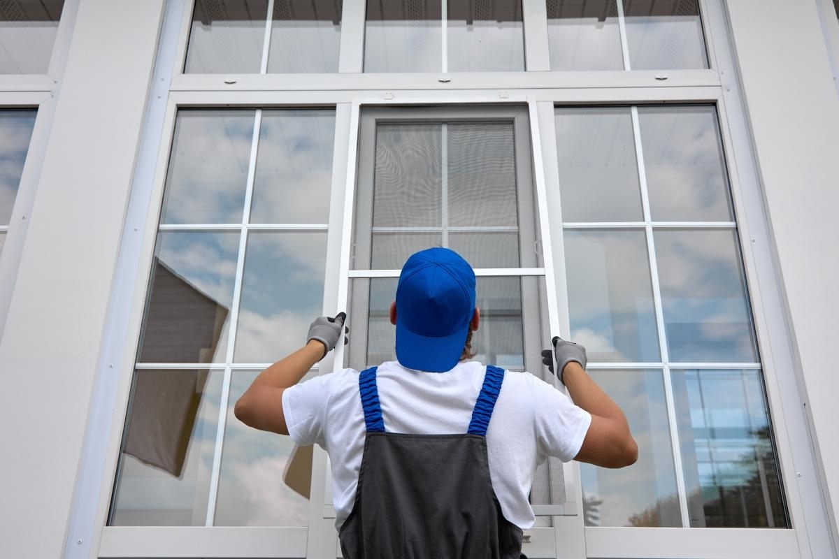 widow professional checking a window