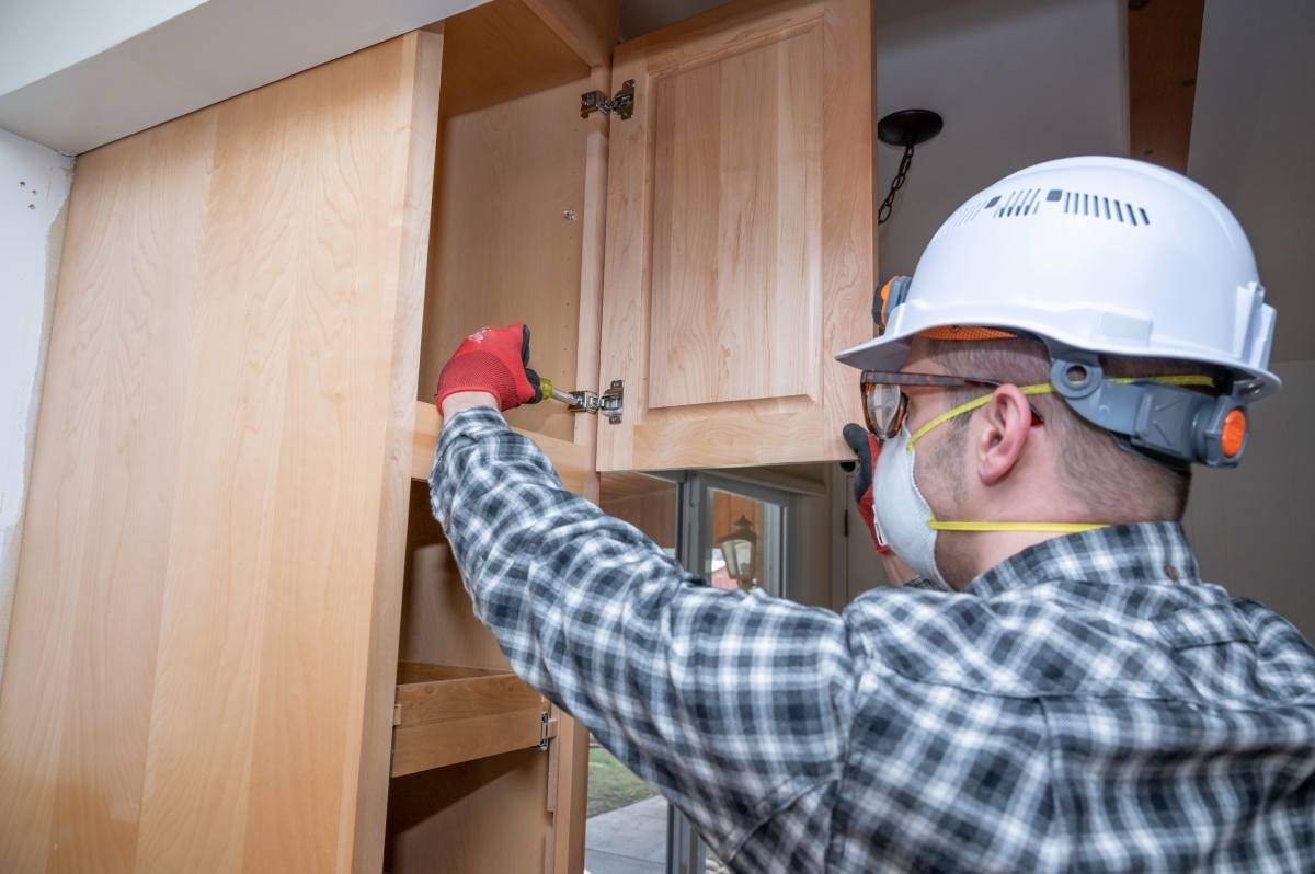 Handyman updating cabinets