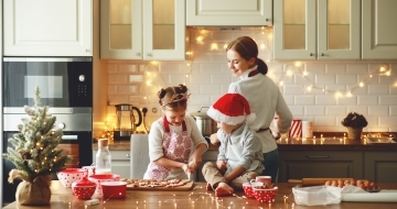 image showing happy family baking christmas cookies