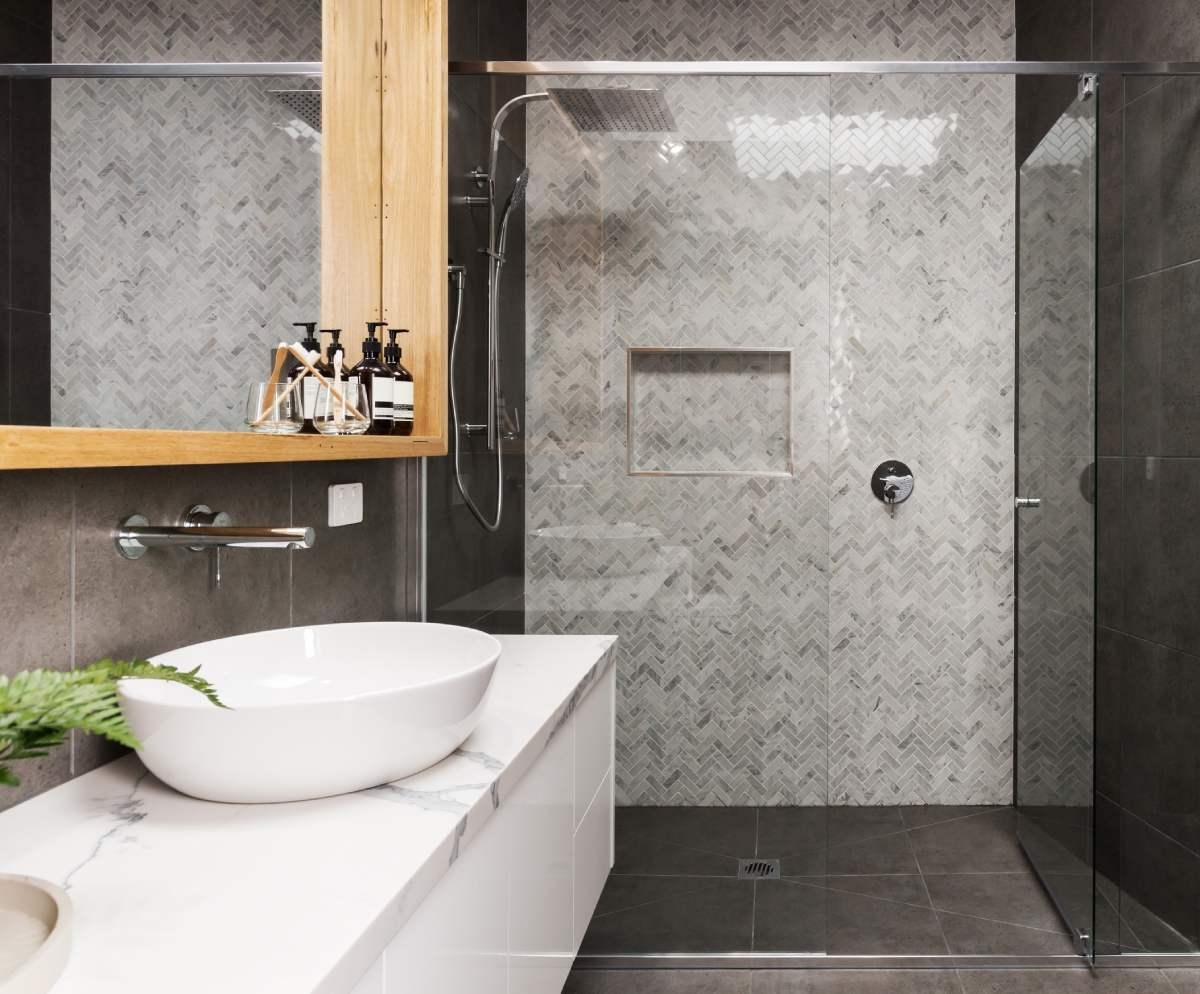 walk in shower with grey ceramic walls