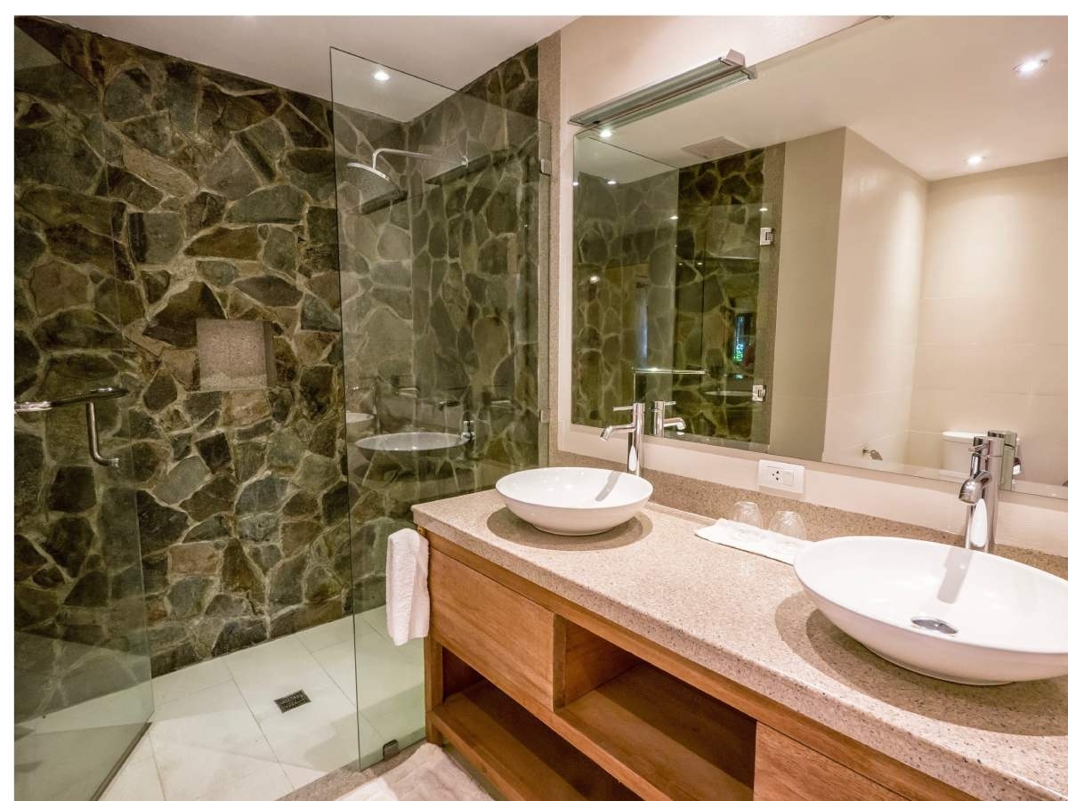 bathroom with natural stone walls